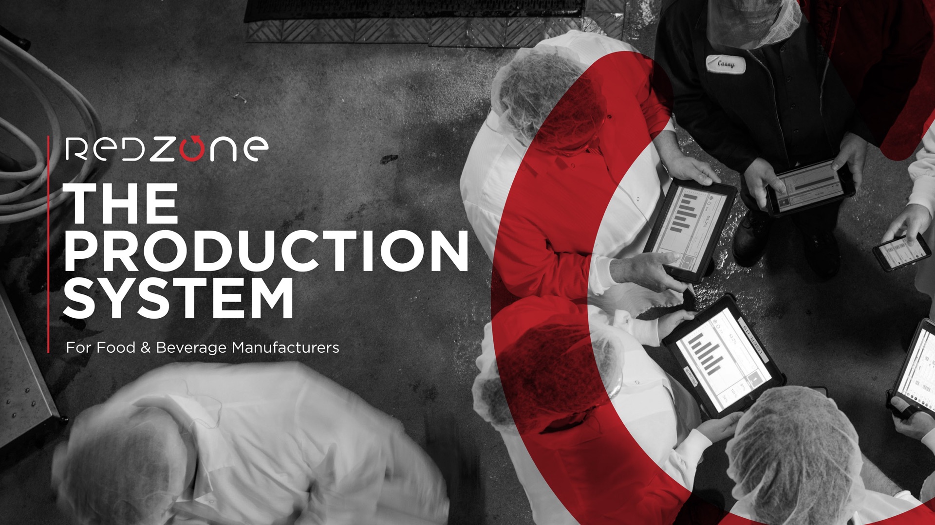 Redzone ‘The Production System’ cover with factory workers on tablets under a red brand arc